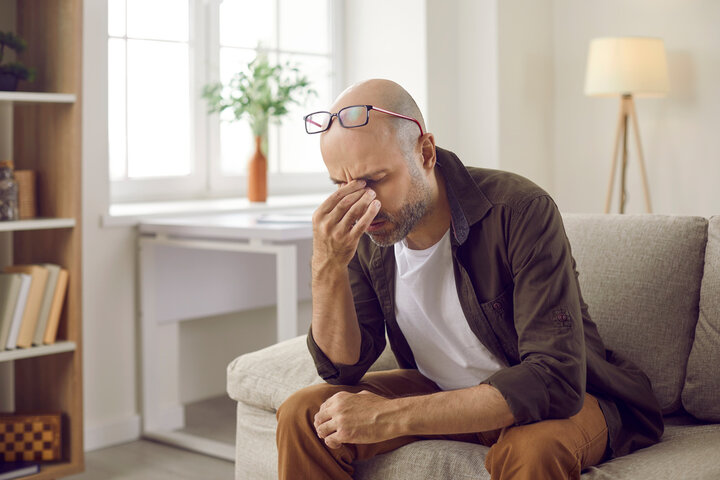 Men under Stress representing Connection Between Stress and Chronic Pain